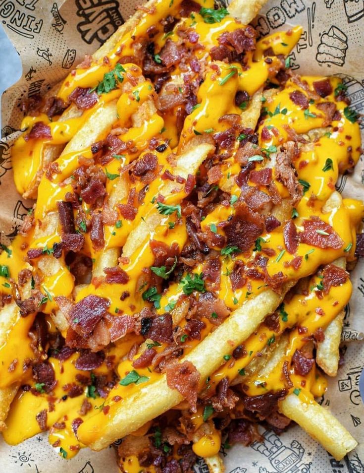 cheesy french fries with bacon and cheese on top