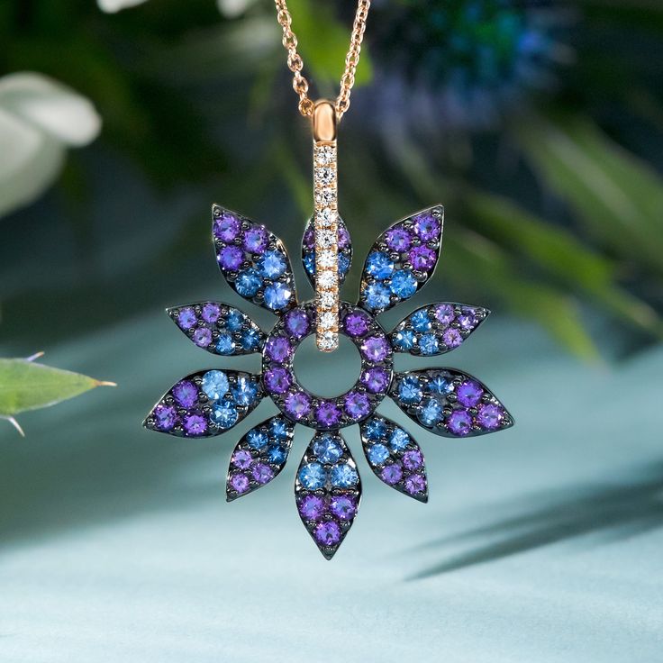 Blossom with everlasting beauty. 🌼 This floral statement necklace features vibrant petals of Grape Amethysts and Blueberry Sapphires and spins in its setting, making it a unique and interactive beauty. ✨ Shop this necklace 20% off at Jared! #necklace #flower #gems #sapphire #amethyst #gold Luxury Purple Sapphire Jewelry, Fine Jewelry Amethyst Multi-stone, Fine Jewelry In Purple Sapphire, Fine Jewelry Sapphire Jewelry In Purple, Fine Jewelry Amethyst With Brilliant Cut, Fine Jewelry With Brilliant Cut Amethyst, Purple Brilliant Cut Fine Jewelry, Purple Multi-stone Pendant Jewelry, Purple Sapphire Jewelry With Brilliant Cut