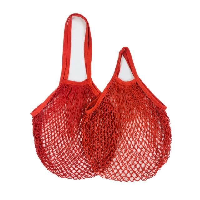 two red mesh bags with handles on white background