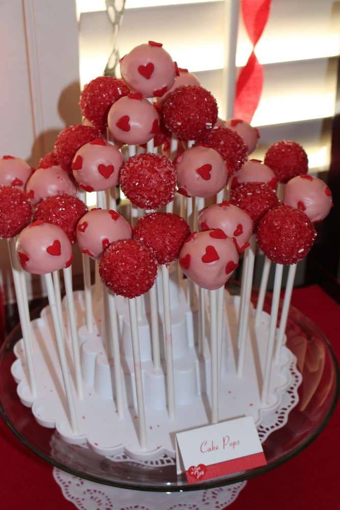 cake pops with strawberries and hearts on them