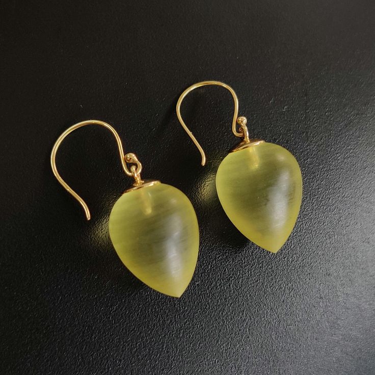 These stunning earrings are set in 14K Solid Yellow Gold with Natural Yellow Quartz with utmost precision. It is an unique gemstone earring pair for nearly every occasion and is completely hassle-free jewelry. 🔷 ABOUT GEMSTONE: Yellow Quartz is a radiant gemstone, celebrated for its bright, sunny yellow hue that symbolizes joy, optimism, and abundance. Known for its uplifting energy, Yellow Quartz is believed to inspire creativity, clarity of thought, and a positive outlook on life, making it a Polished Drop Earrings For Gift, Polished Finish Drop Earrings For Gift, Handmade Briolette Yellow Gold Earrings, Handmade Yellow Gold Briolette Earrings, Yellow Briolette Earrings For Formal Occasions, Luxury Earrings With Ear Wire For Gift, Luxury Earrings With Ear Wire As Gift, Handmade Yellow Gold Pear-shaped Jewelry, 14k Gold Briolette Earrings Gift