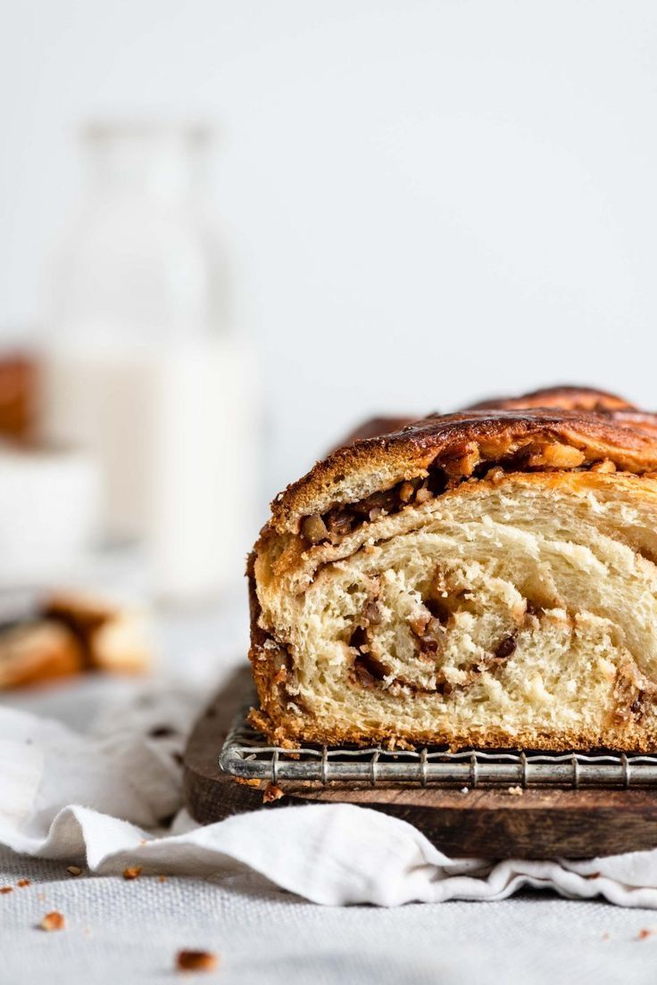 a loaf of cinnamon swirl bread on a cooling rack