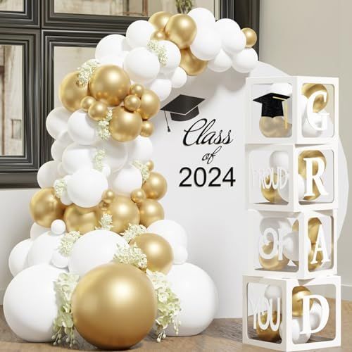 graduation decorations and balloons are on display in front of the class room door, which is decorated with gold and white balloons