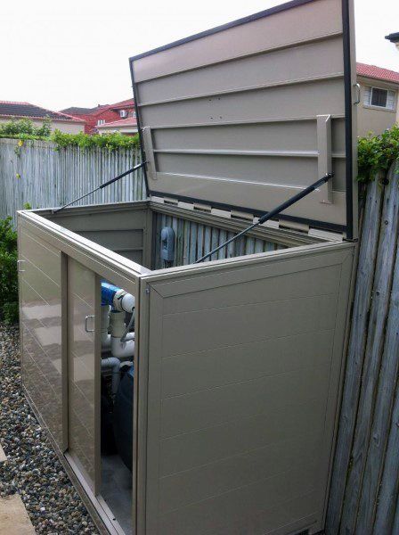 an outdoor storage box with the door open and pipes running through it's sides