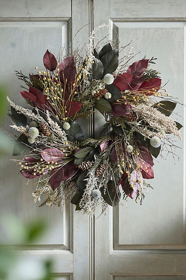 a wreath is hanging on the front door