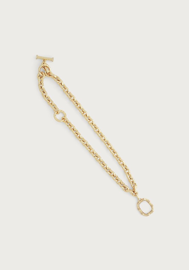 Indulge in the luxury of the Farrier Thick Chain Necklace. Crafted with 18k gold dipped brass and featuring a luxurious toggle clasp, this necklace exudes the sophistication and elegance of an heirloom piece, while providing a modern and versatile design that can be worn many ways. This collection was inspired by the age-old profession of farriers, who are craftsman that hammer and shape horse shoes. Here, we have styled the Farrier Chain Necklace with the pendant from our Bamboo Pendant Necklac Luxury Figaro Paperclip Chain Necklace, Luxury Timeless Figaro Chain Necklace, Luxury Metal Necklace With Figaro Chain, Gold-tone Necklace With Figaro Chain And Oval Link, Luxury Yellow Gold Lariat Toggle Necklace, Michael Aram Black Orchid, Thick Chain Necklace, Black Iris, Horse Shoes