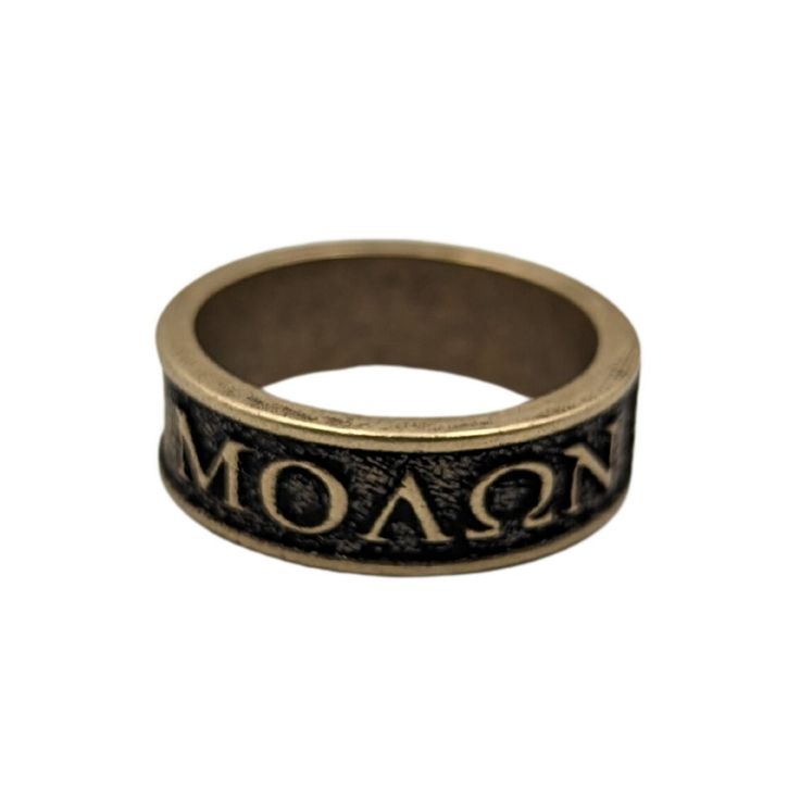 Molon Labe Stand your ground with our bold and powerful Molon Labe Spartan Ring, a symbol of defiance and unwavering courage. This striking piece of jewelry captures the spirit of ancient Spartan warriors, known for their indomitable will and unyielding resolve.Expertly crafted with meticulous attention to detail, the ring features the iconic phrase "Molon Labe" etched onto the surface. In Greek, it means "come and take it," symbolizing the Spartans' refusal to surrender their weapons in the fac Symbolic Gold Rings With Antique Finish, Symbolic Antique Finish Ring Jewelry, Antique Gold Symbolic Engraved Jewelry, Symbolic Engraved Antique Gold Jewelry, Symbolic Antique Finish Ring, Symbolic Bronze Jewelry, Adjustable Engraved Bronze Ring, Symbolic Bronze Ring Jewelry, Symbolic Bronze Engraved Ring As Gift