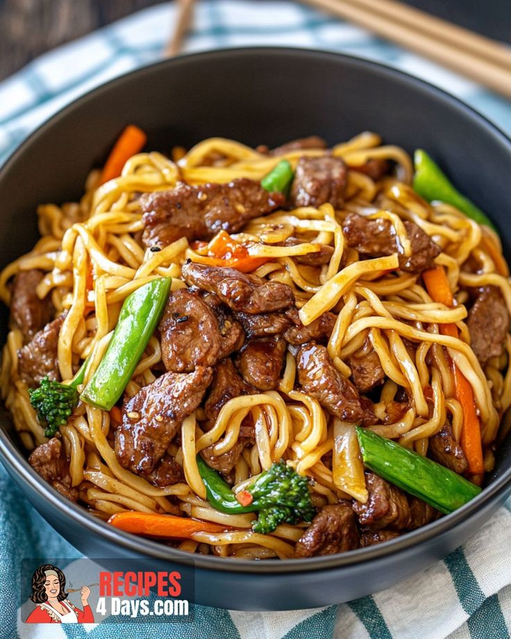 a bowl filled with beef and noodles on top of a blue and white checkered table cloth