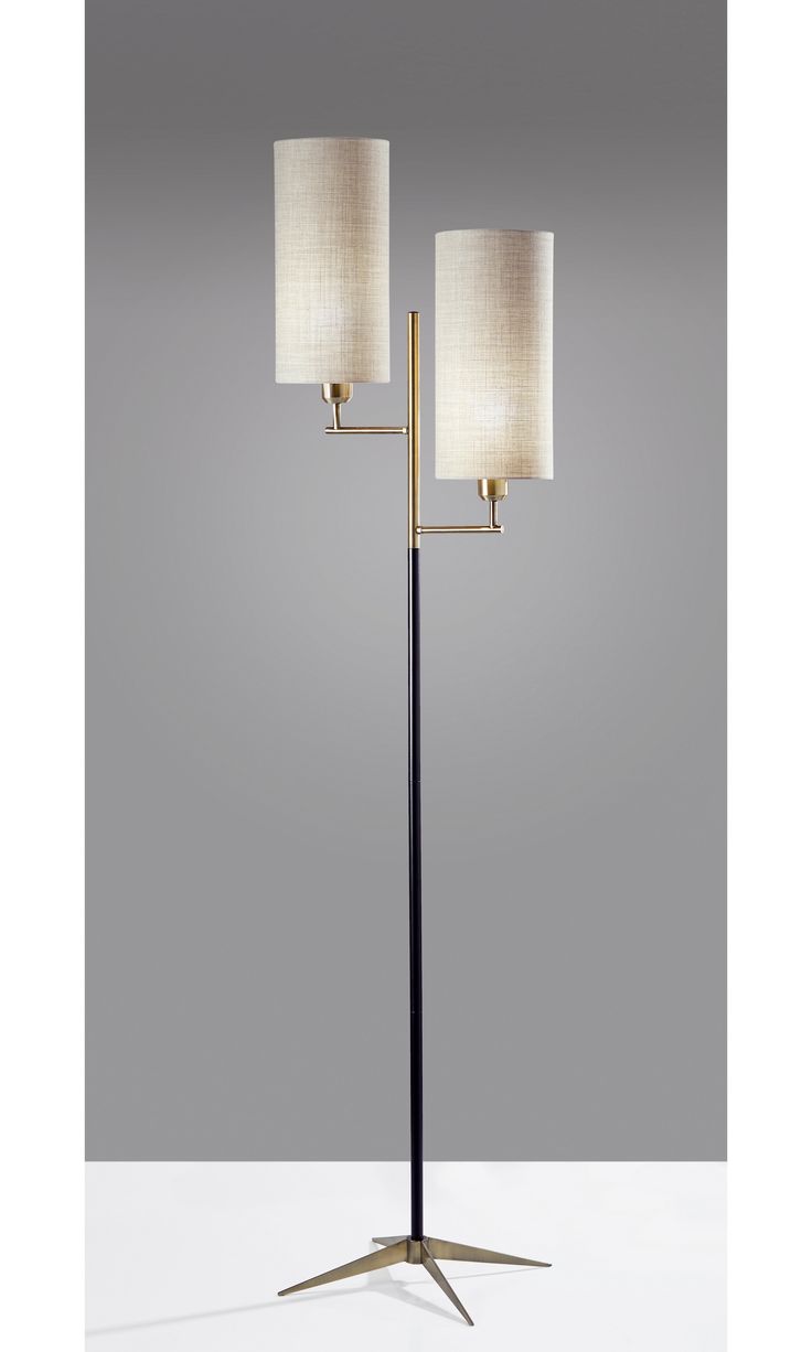 a floor lamp with two lamps on it