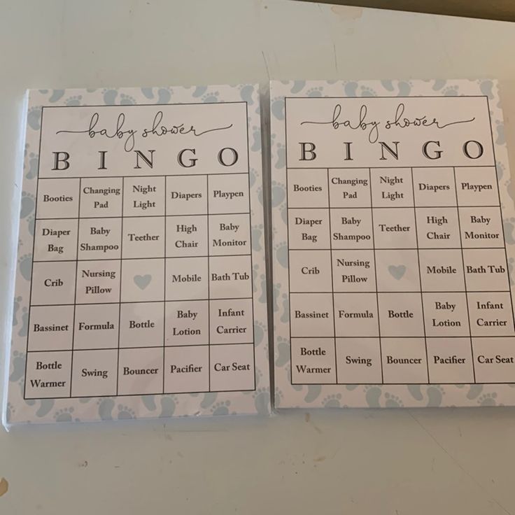 two baby shower games are sitting on a table