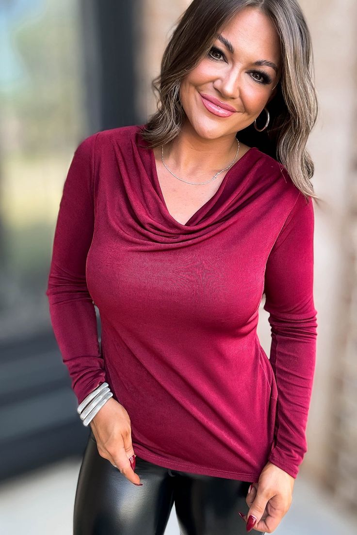 Show off your playful side in our Burgundy Cowl Long Sleeve Top. Made of sassy, slinky jersey fabric, this stretchy top is both comfortable and stylish. Perfect for adding a unique touch to any outfit! Alexis is wearing her true size medium and would stay true to size in this. We recommend following the size chart below for the best fit: S= 2-6 M= 8-10 L= 12-14 XL= 16-18 Chic Solid Color Elastane Tops, Fitted Long Sleeve Top In Solid Color, Chic Cowl Neck Top For Night Out, Versatile Fitted Cowl Neck Top, Fitted Foldover Top For Night Out, Elastane Tops For Night Out In Fall, Stretch Solid Color Cowl Neck Top, Versatile Stretch Solid Color Tops, Stretch Elastane Foldover Top