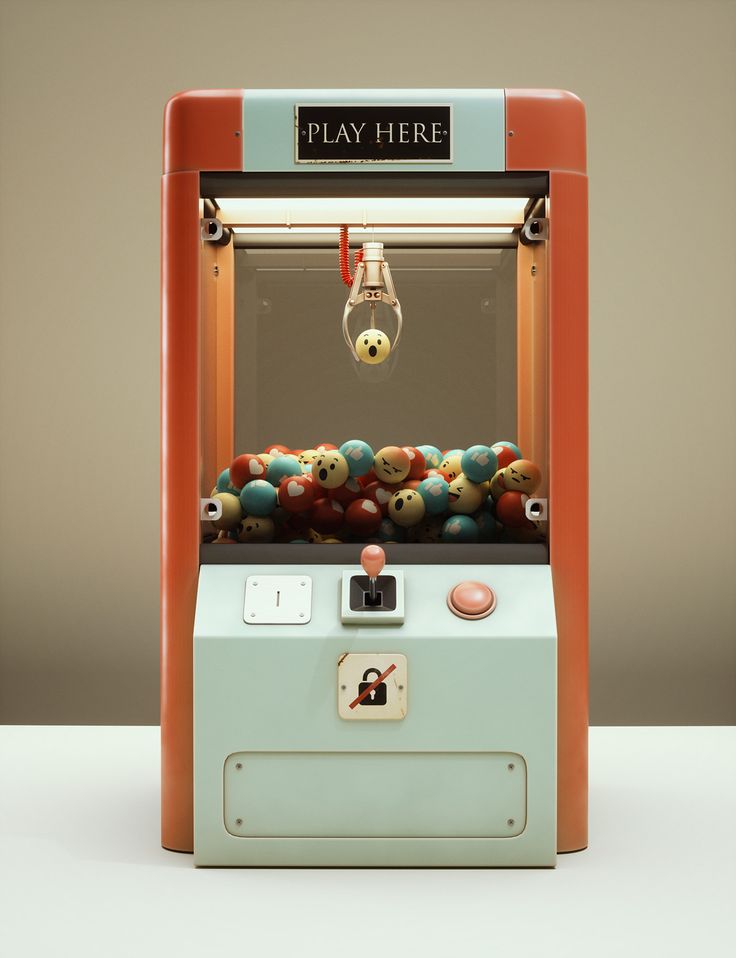 an old fashioned arcade machine with lots of balls in it's display case on a white surface