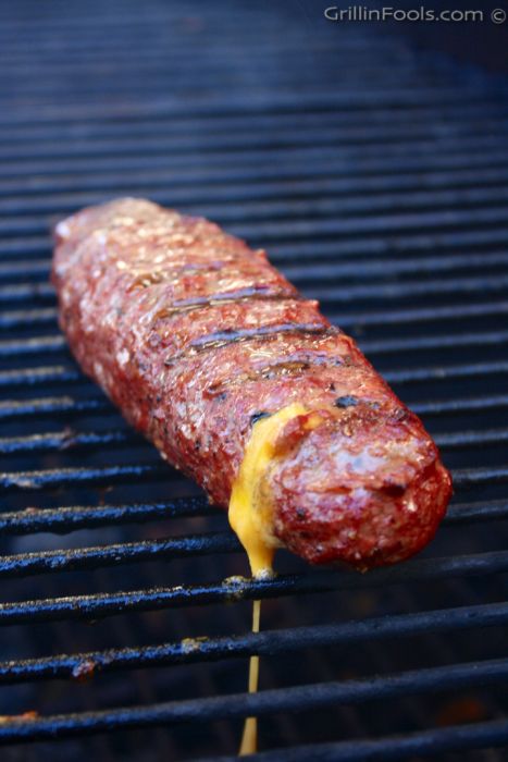 a hot dog is being grilled on the grill