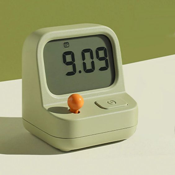 an alarm clock sitting on top of a table