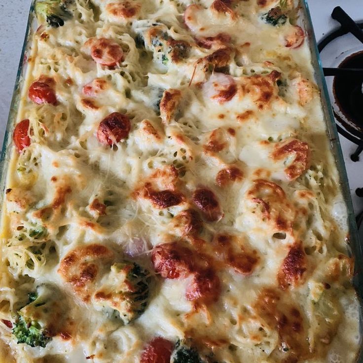 a casserole dish with broccoli and cheese