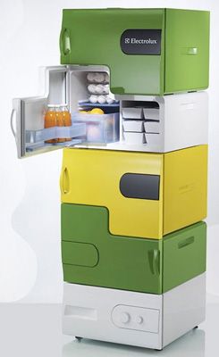 an open refrigerator sitting on top of a white counter next to another green and yellow fridge