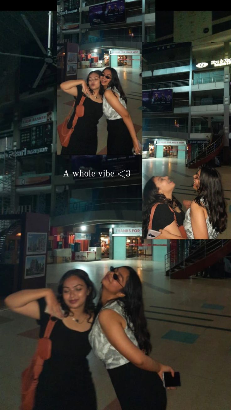 two women are posing for pictures in front of a building at night and one is holding her hand on her hip