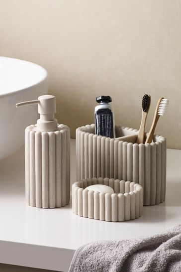 two pictures of bathroom accessories on a table