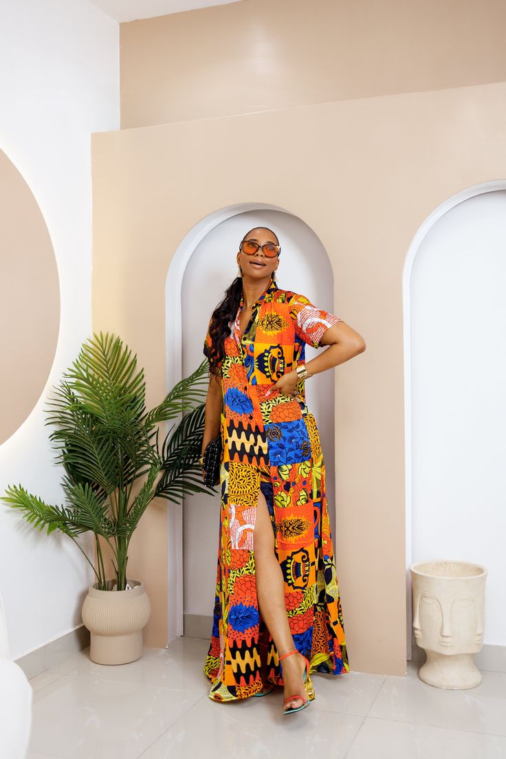 PRODUCT DETAILS: Designed in the U.S., hand-crafted in Africa Delivery within 2 weeks Multiple prints available This sophisticated unlined kaftan dress is designed with traditional Silk African Ankara fabric shown in multi-colors. The buttoned front style is perfect for making a grand impression! Can be worn as evening wear to various events such as weddings, dinner parties and other formal occasions. Model is 5'9 FABRIC CARE: Dry Clean. Hand Wash. Machine Wash SIZE CHART: Traditional Multicolor V-neck Maxi Dress, Printed Free Size Maxi Dress With Short Sleeves, Vibrant Short Sleeve Maxi Dress For Vacation, Traditional Multicolor V-neck Dress, Traditional Printed Maxi Kimono, Traditional Printed Maxi Length Kimono, Traditional Maxi Length Printed Kimono, Vibrant Printed V-neck Maxi Dress, Vibrant V-neck Printed Maxi Dress