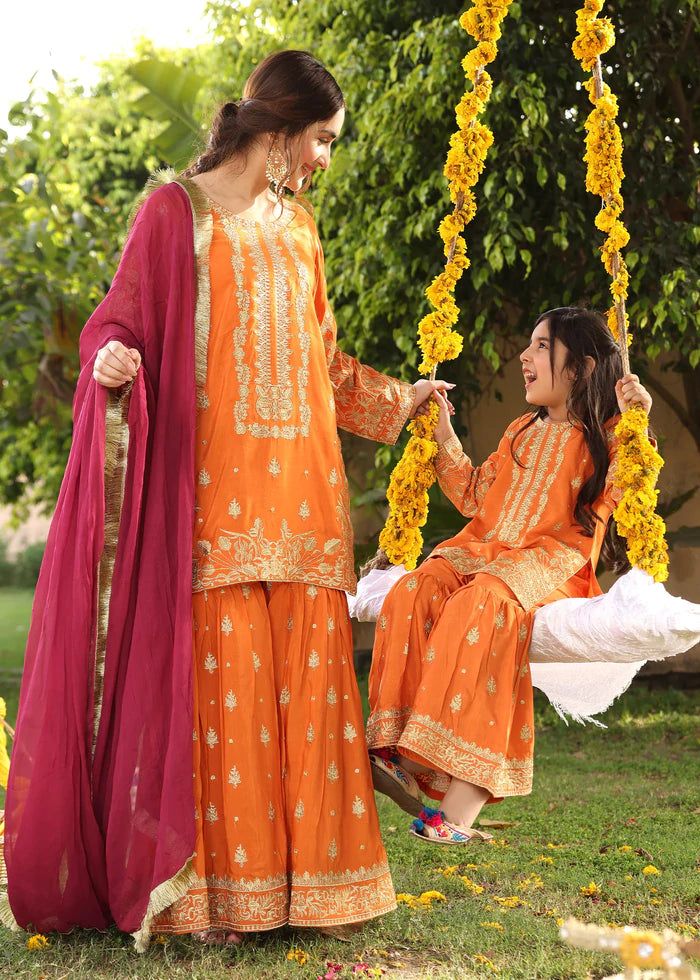 Description Shirt : Orange raw-silk shirt with Embroidery. Trouser : Orange raw-silk Gharara with Embroidery. Dupatta : Reddish maroon chiffon dupatta. Long Sleeve Sharara With Dabka For Navratri, Orange Chinon Sharara For Eid, Traditional Resham Embroidered Sharara, Long Sleeve Sharara With Dabka For Festivals, Orange Sharara With Straight Kurta For Eid, Festive Jamawar Palazzo Set, Traditional Chinon Palazzo Set, Long Sleeve Orange Sharara For Festive Occasions, Navratri Sharara With Dabka