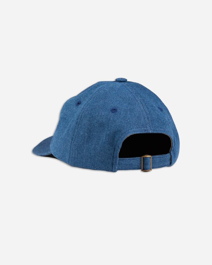 A true classic, this cap is meant to be in the director's chair. We used a medium washed, 10oz. denim on this one for a convergence of workwear and contemporary fashion. 100% indigo denim 6-panel Embroidered logo Self fabric adjustable strap Antique brass metal adjuster MADE IN NYC Blue Denim Baseball Cap With Curved Brim, Outdoor Denim Blue Hat, Medium Wash Denim Hat With Curved Brim, Adjustable Denim Hat With Curved Visor, Medium Wash Denim Baseball Cap With Curved Brim, Dark Wash Denim Hat With Curved Brim, Classic Adjustable Dad Hat With Logo Patch, Adjustable Denim Cap, Adjustable Denim Blue Baseball Cap