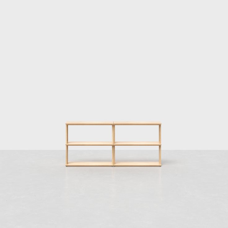 a wooden shelf sitting on top of a white floor