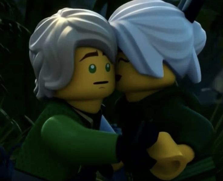 two legos are hugging each other in the jungle