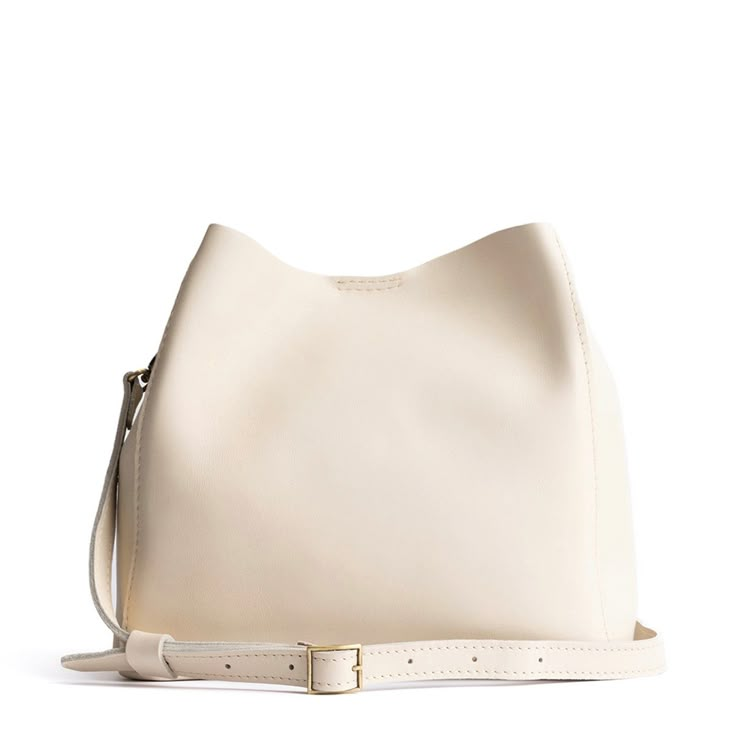 Bone | symmetrical bucket bag with latch closure and removable crossbody strap Portland Leather Goods, Butterfly Bags, Purse Organizer, Leather Tote Purse, Canvas Purse, Utility Bag, Leather Stand, Mens Leather Bag, Almost Perfect