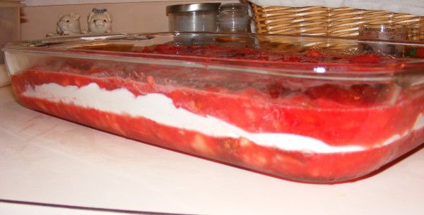 a glass container filled with food sitting on top of a counter