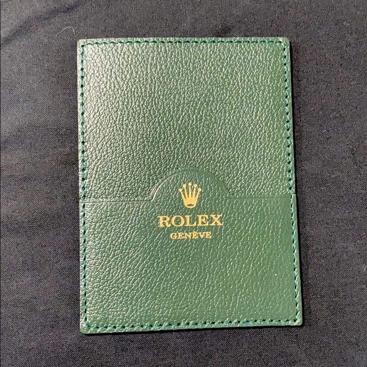 Green Leather Rolex Genve Card Holder Wallet With Signature Gold Crown Logo At Front - Rolex Card Holder - Green Leather - Unlined With Card Slots Measurements: (Approximate) Width: 3.5" Height: 4.75" Color: Green Condition: Nwot Designer Green Wallets For Gift, Designer Green Wallet As Gift, Designer Green Wallets As Gift, Luxury Green Wallets With Rfid Blocking, Luxury Green Wallet With Rfid Blocking, Green Luxury Card Holder With Interior Slots, Luxury Green Wallets With Interior Card Slots, Luxury Green Wallet With Interior Card Slots, Green Luxury Wallets With Interior Card Slots