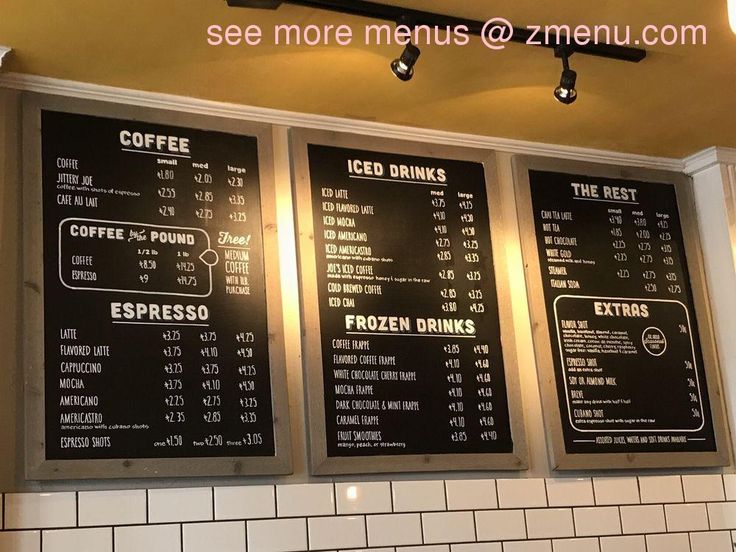 three menus on the wall in a restaurant