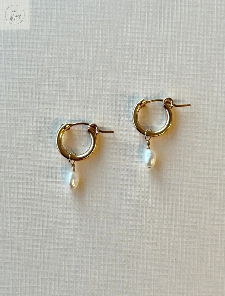 Introducing our Pearl huggie earrings: Ella Hoops. Dainty elegance meets a deep love for the sea. May these lovely earrings connect you to your deepest sence of self. Crafted from 14K Gold Filled materials, these 1/2" (13mm) hoops feature genuine freshwater rice pearls that effortlessly elevate any outfit. Handcrafted with care in the heart of Hawaii by Mandy, each pair possesses a unique touch of artisan quality. To make your experience even more special, every piece comes with our exclusive si Gold Hoop Earring, Rice Pearls, Gold Pearl Earrings, Pearl Earring, Deep Love, Huggie Earrings, Pearl Gemstone, Lovely Earrings, Gold Hoop