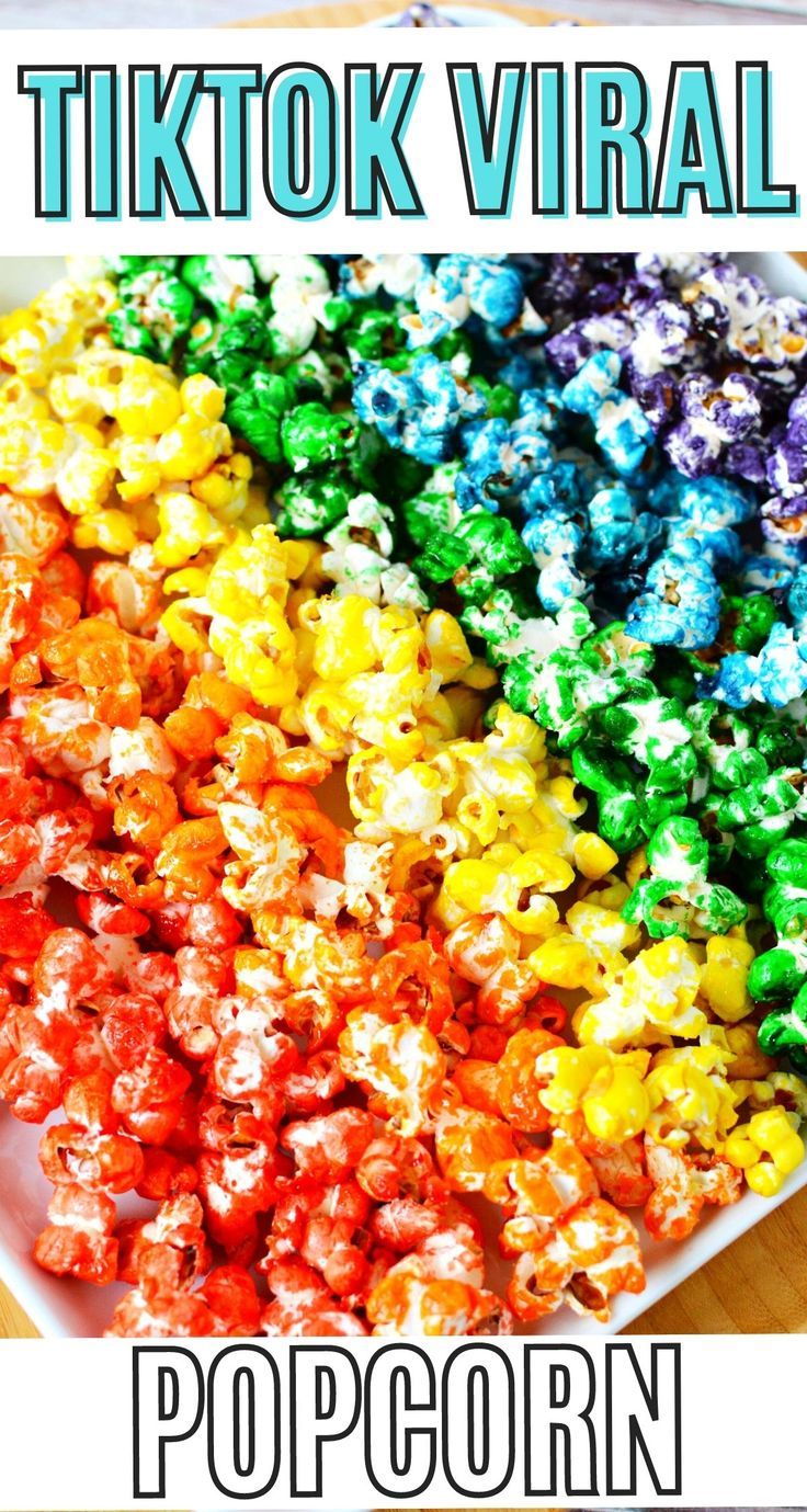 rainbow popcorn in a white bowl with text overlay