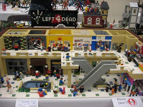 a lego model of a building with people in it