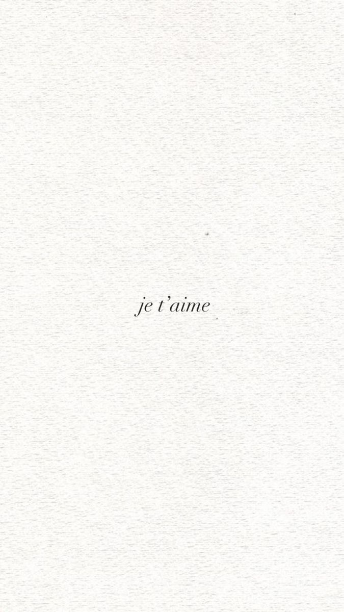 an open book with the words je t'aime written in black on it