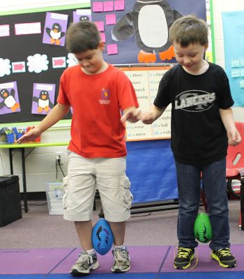 two young boys standing next to each other