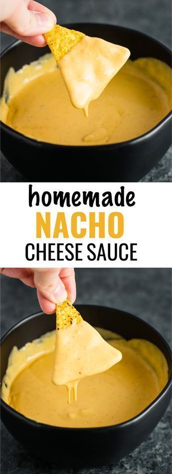 homemade nacho cheese sauce in a black bowl with a tortilla chip being dipped into it