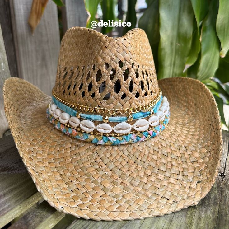 This coastal cowgirl hat has blue fabric with gold details and shells. A coastal cowgirls dream! All hats are around 22-24 inches inside but come with an adjustable string that can tighten the hat inside. Check out my Instagram @delisico *PLEASE MESSAGE ME IF YOU NEED FOR A SPECIFIC DATE. BIRTHDAY, CONCERT, EVENT* Coastal Cowgirl Beaded Hat, Coastal Cowgirl Hat Ideas, Cowboy Hat Jewelry, Coastal Cowgirl Hat Beads Diy, Coastal Cowgirl Trucker Hat, Coastal Cowgirl Hats Diy, Coastal Cowgirl Hat Diy, Cowgirl Hats Decorated, Beach Cowgirl Hat