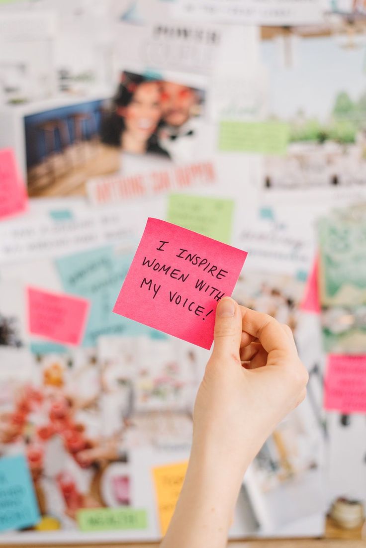 a person holding up a piece of pink paper with writing on it that says i hope women will my voice