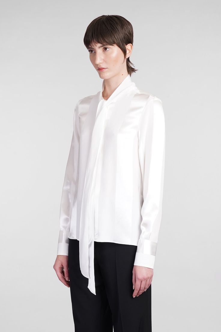 Shirt in white viscose, tie neck, long sleeves, frontal buttoning, 100% Viscose, Made in Italy, model is 180 cm and wears size 40 White Tie Neck Blouse For Formal Occasions, White Tie Neck Blouse For Work, Modern Long Sleeve Silk Blouse, White Long Sleeve Modern Blouse, Modern White Long Sleeve Blouse, White Silk Tie Neck Top, Chic White Tie Neck Shirt, Luxury White Workwear Blouse, Luxury White Blouse For Work