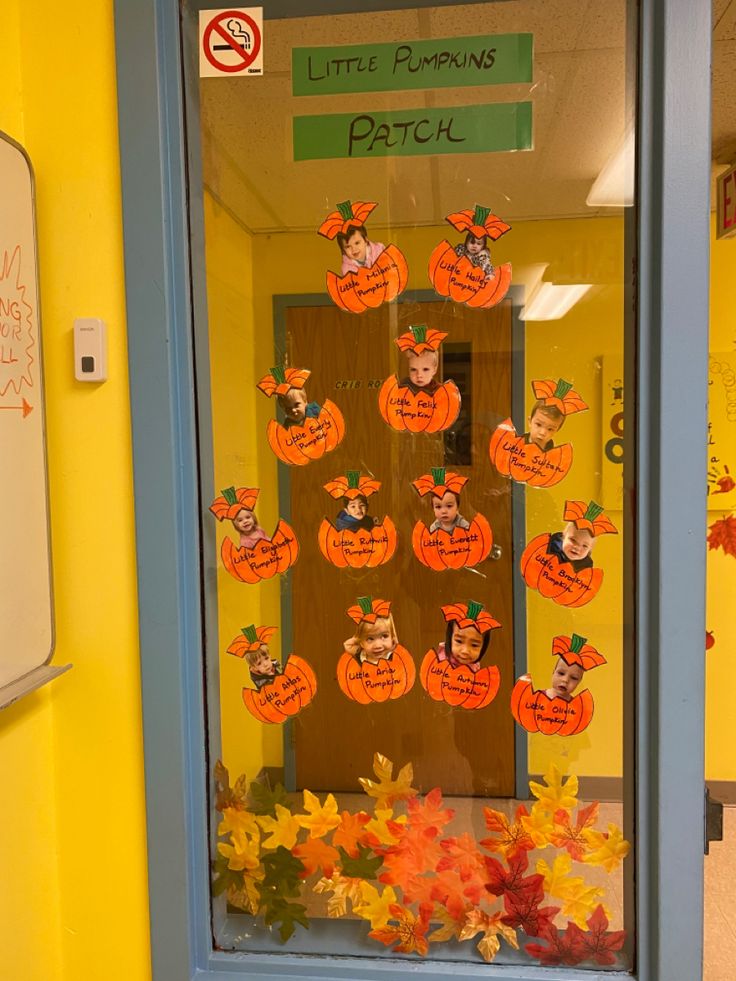 a classroom door decorated with pumpkins for halloween