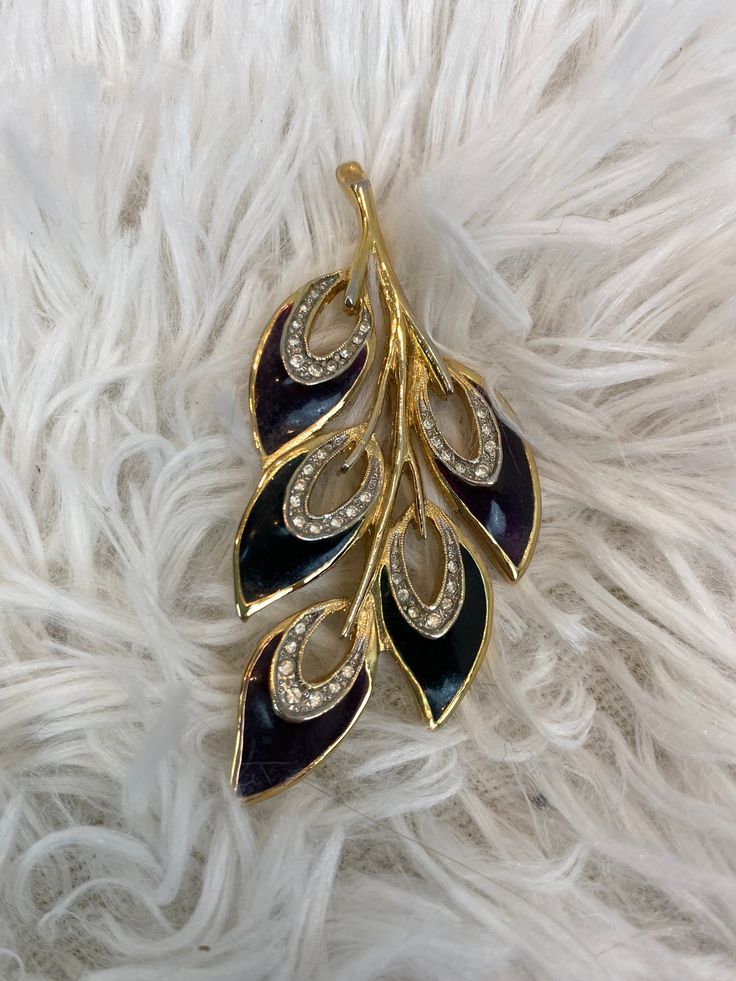 "Mid century Peacock Brooch / Rhinestone Brooch This is a gorgeous vintage brooch that looks inspired by peacock feathers. It has tiny rhinestones and a lot of style. Height 2.75 \" Width 1.25 \" Condition: Excellent vintage condition. Sturdy and ready to wear. $ 42 Includes domestic shipping and insurance. If you have any questions please feel free to send me a message I am here to help. Megan" Brooch Design, Peacock Brooch, Peacock Feathers, Rhinestone Brooches, Vintage Brooch, Crown Princess, Vintage Brooches, Precious Metals, Brooch Pin