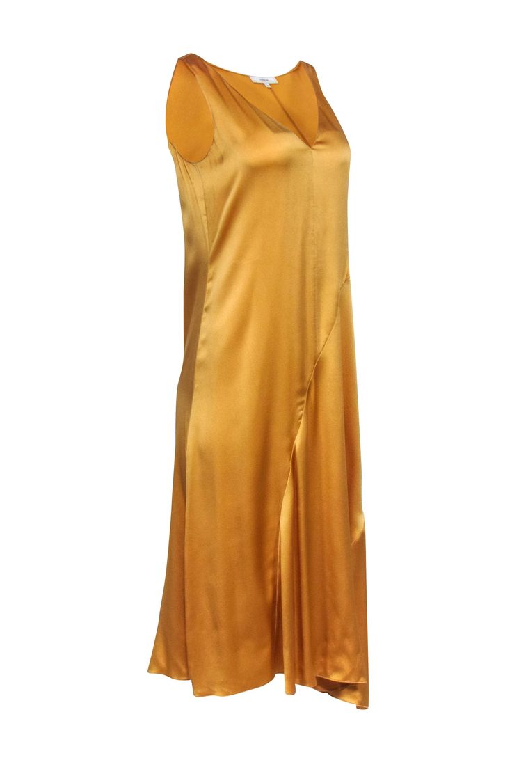 A true closet essential, this gold slip dress by Vince is an all-purpose style. Crafted from smooth silk with a v-neck, it stands alone or can be paired with a range of tops: blazers, jackets, and oversized sweaters. Wear it all year-long and pack it for travel as it's truly perfect for any occasion! Size S 100% Silk Sleeveless Slip style V-neck Bias cut Bust 36" Waist 35" Shoulder to hem 45.5" Gold V-neck Slip Dress For Spring, Elegant Gold V-neck Slip Dress, Gold Fitted Silk Slip Dress, Gold Satin V-neck Slip Dress, Gold Silk Slip Dress For Formal Occasions, Formal Gold Slip Dress With Bias Cut, Elegant Gold Slip Dress With Bias Cut, Gold Fitted V-neck Slip Dress, Gold Bias Cut Slip Dress For Formal Occasions