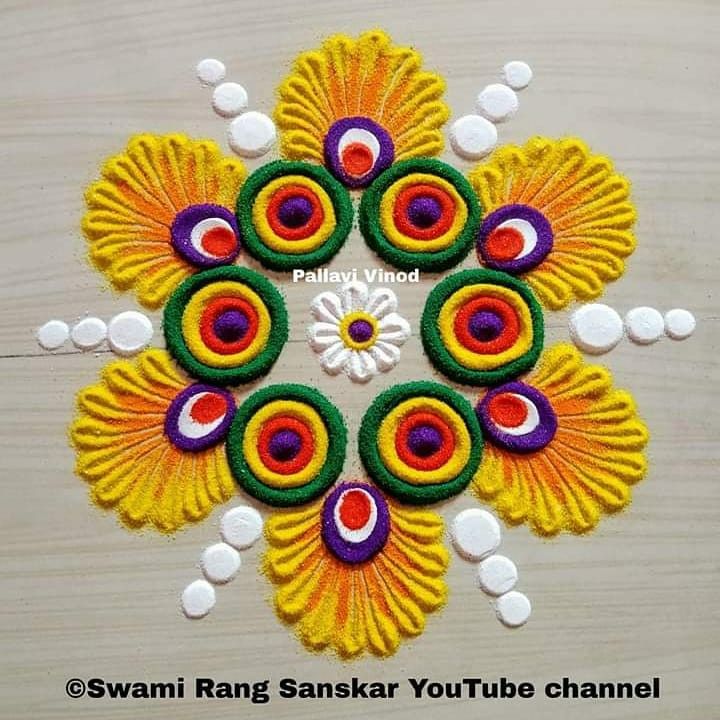 an image of colorful rangdi work on the floor