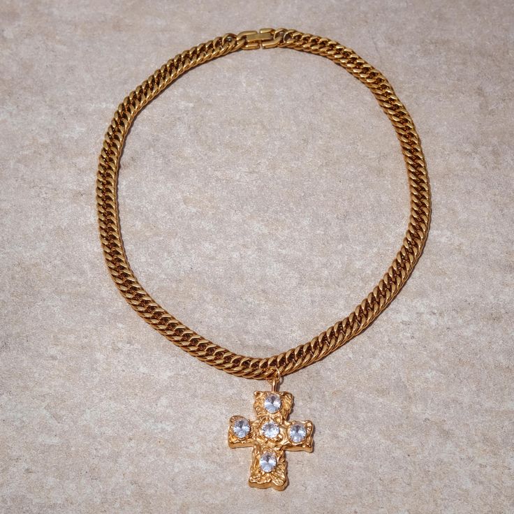 Introducing the “Adorned Cross Necklace” from the exclusive Solstress “Favored” collection. This bold, handcrafted piece features an 18” 18k gold chain that exudes strength and elegance. At its center, a prominent gold statement cross is embedded with vibrant diamond stones, creating a dazzling focal point. Perfect for making a striking impression, the Adorned Cross Necklace combines luxurious craftsmanship with timeless design, making it a standout addition to your jewelry collection. Gold Plated Cross Chain Necklace, Elegant Gold Chain Necklace With Cross Pendant, Elegant Crucifix Chain Necklace, Elegant Gold Chain Necklace With Cross, Gold Cross Pendant Chain Jewelry, Gold-plated Cross Pendant Necklace With Chain, Luxury Cross Pendant Jewelry With Adjustable Chain, Elegant Crucifix Cross Necklace With Chain, Luxury Cross Jewelry With Adjustable Chain