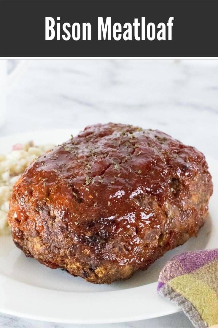 meatloaf on a white plate with mashed potatoes