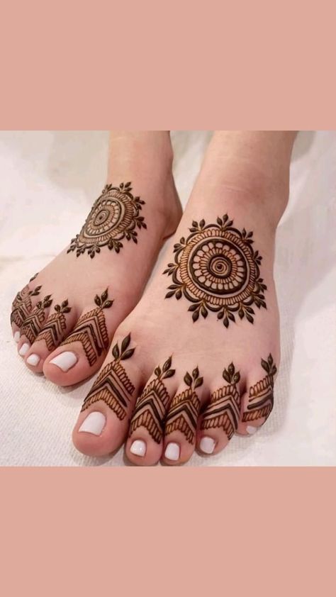 feet with henna tattoos on them