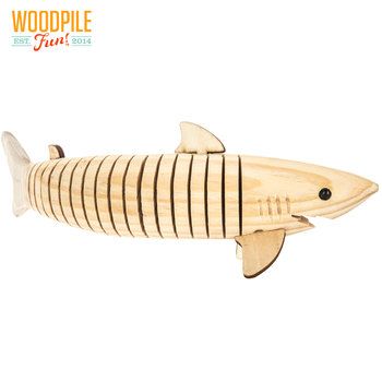 a wooden toy that is shaped to look like a fish with stripes on it's body