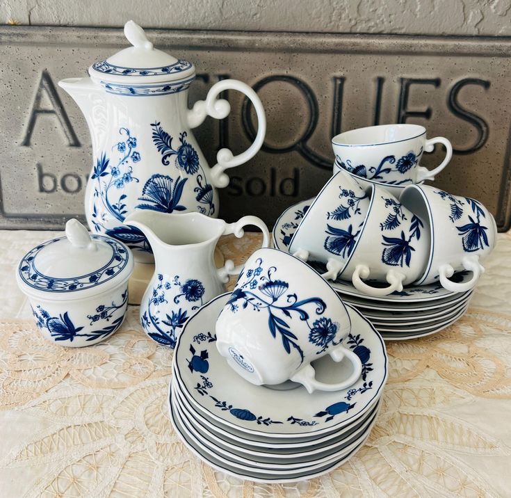 a table topped with blue and white dishes