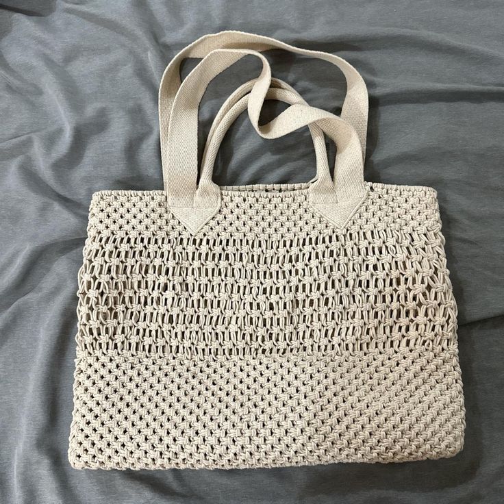 Perfect For A Beach Trip Or Vacation Never Used Casual Cream Tote Beach Bag, Casual White Crochet Rectangular Bag, Casual White Rectangular Crochet Bag, White Lightweight Crochet Bag For Beach, Cream Crochet Bag For Everyday Beach Use, Casual Cream Beach Bag With Adjustable Strap, White Crochet Bag For Everyday Use, White Lightweight Shoulder Bag For Beach, Lightweight White Shoulder Bag For Beach